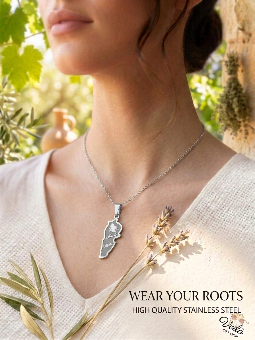 Woman wearing a silver stainless steel Lebanon map necklace with cedar tree and Arabic calligraphy