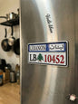 Sticker resembling a Lebanese license plate on a refrigerator in a kitchen.