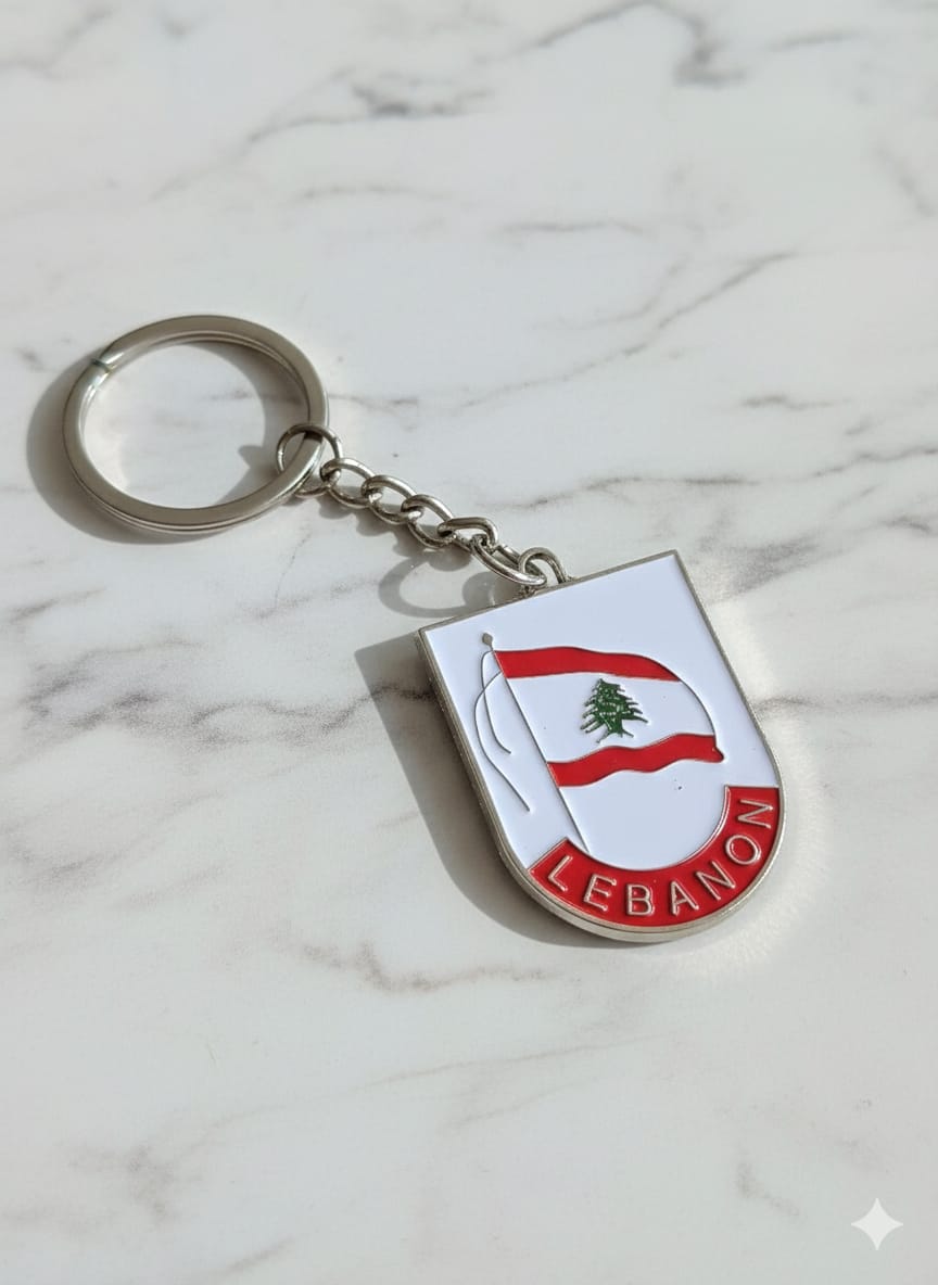 Keychain with Lebanese flag design on a marble surface