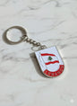Keychain with Lebanese flag design on a marble surface