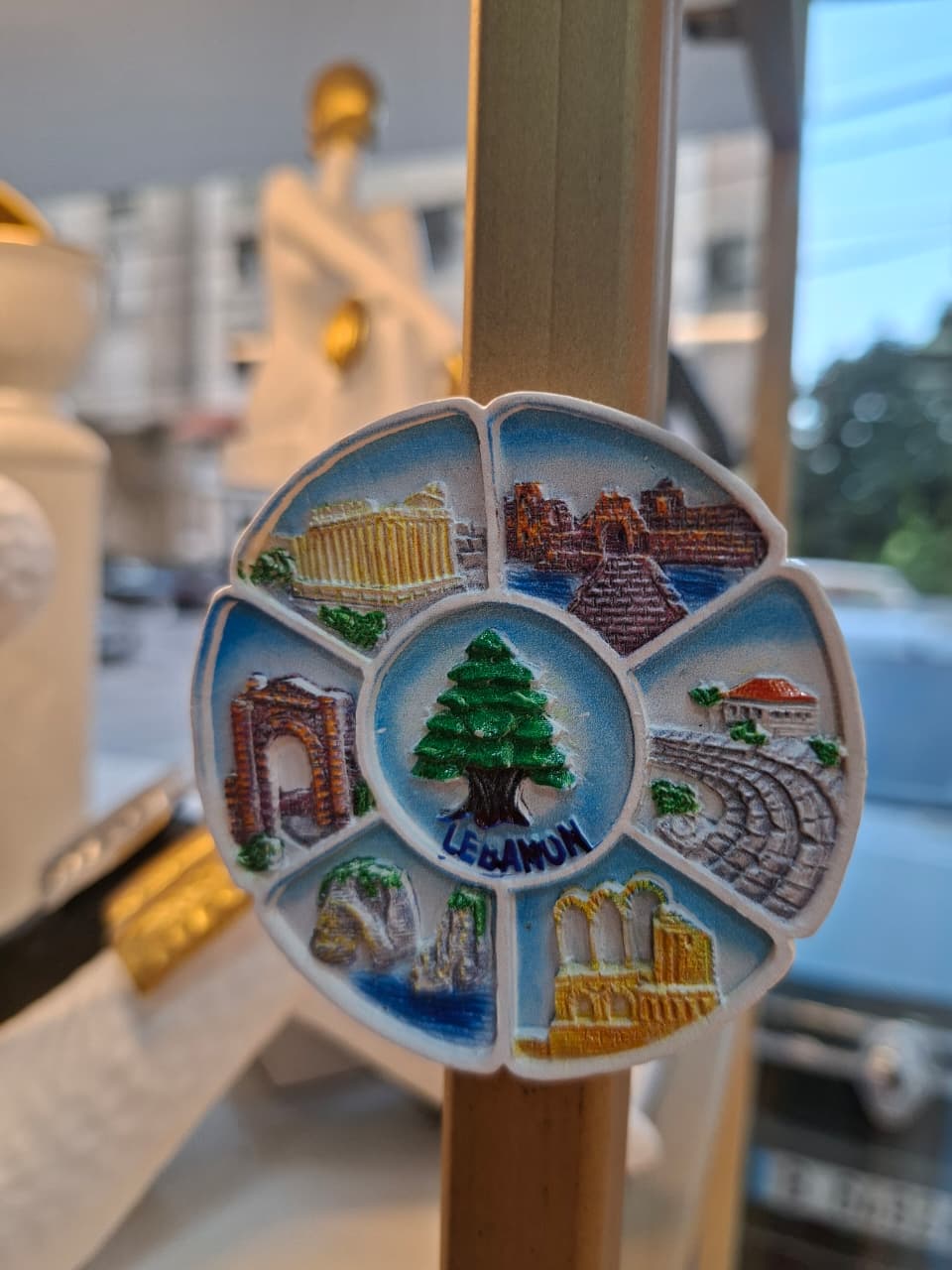 Colorful souvenir magnet with landmarks of Lebanon on a stick
