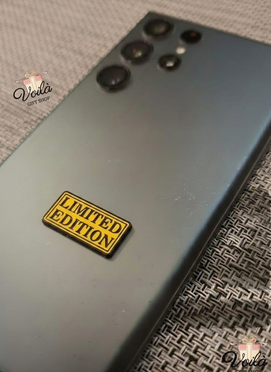 Back of a smartphone with a 'Limited Edition' badge on a textured surface