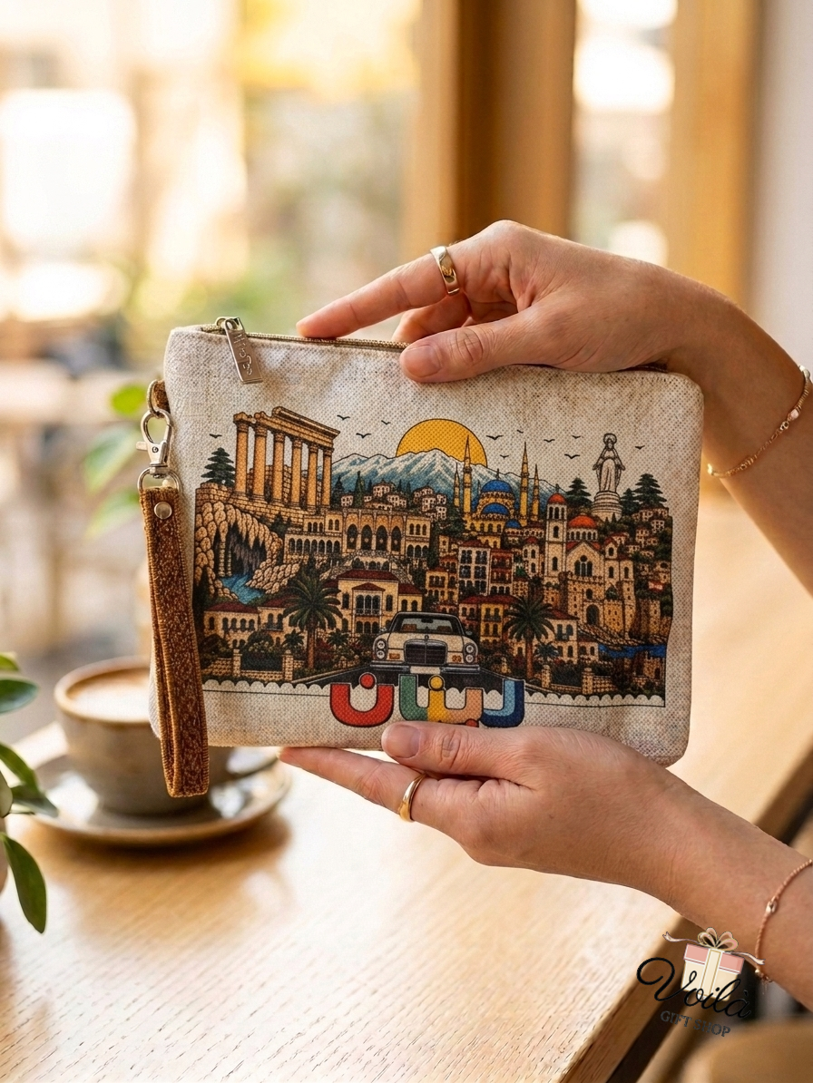 A woman holding a linen clutch pouch illustrated with Lebanese landmarks and the Arabic word for Lebanon