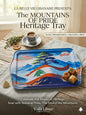 Heritage tray with mountain design on a wooden table with coffee and cookies.