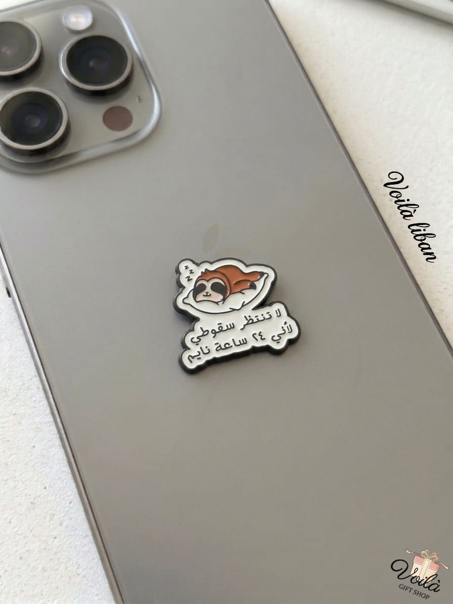 Phone case with a cartoon character and Arabic text on a smartphone