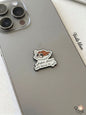 Phone case with a cartoon character and Arabic text on a smartphone