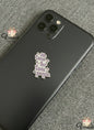 Phone case with 'No time for toxic people' charm on a gray surface