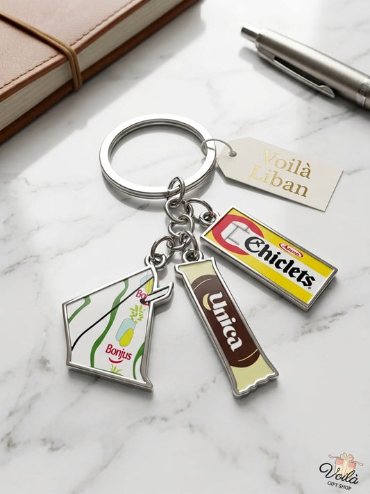 Keychain with vintage candy packaging charms on a marble surface