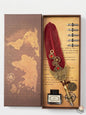 Decorative feather quill pen set with ink bottle in a decorative box featuring world map design.