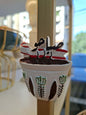 Small cup with a decorative design on a blurred background