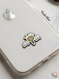 Phone case with a sticker of a brain and light bulb on a white surface
