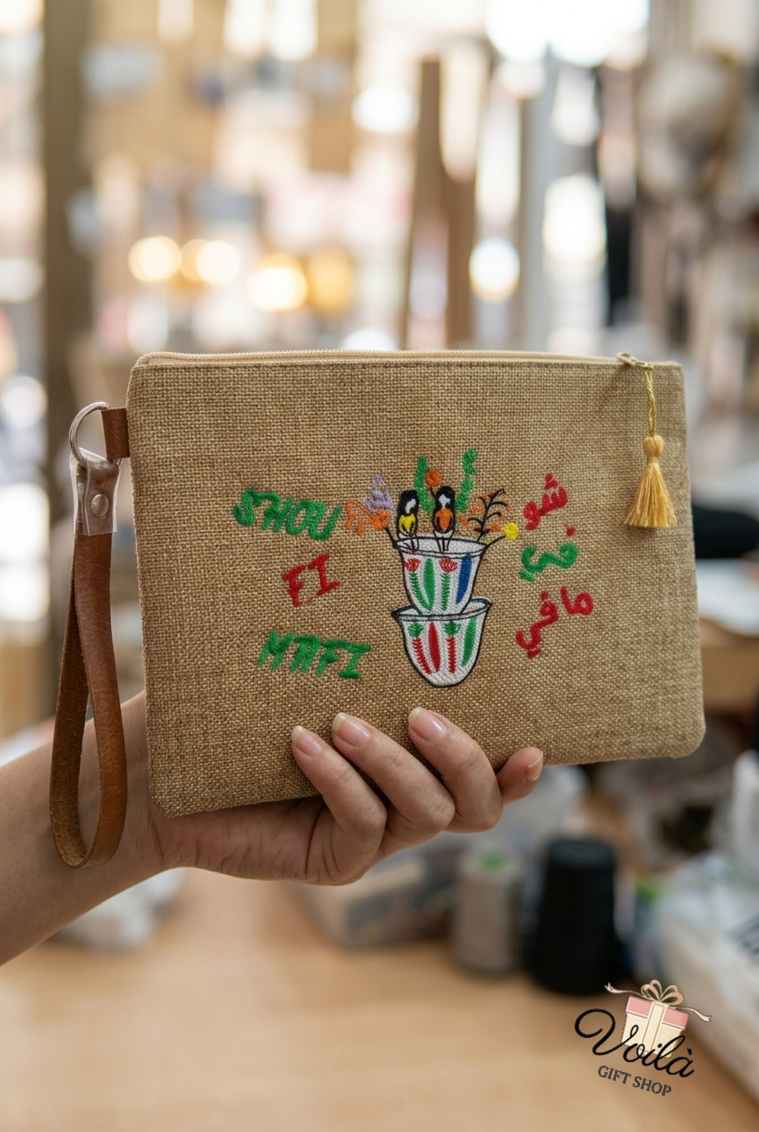Hand-embroidered burlap clutch with Lebanese coffee cups and Shou Fi Mafi text