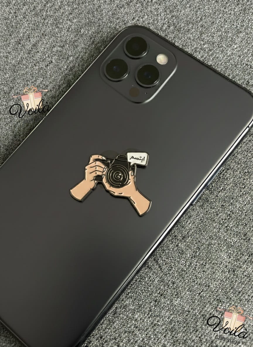 Phone case with a camera design on a black phone