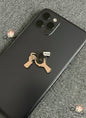 Phone case with a camera design on a black phone