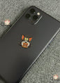 Phone case with cartoon character design on a textured surface