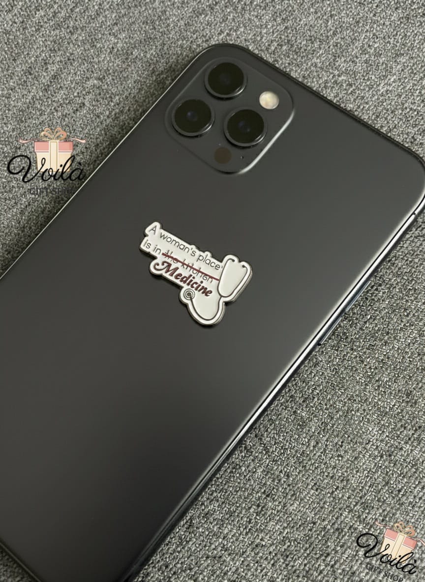 Black phone case with a white sticker on a gray textured background