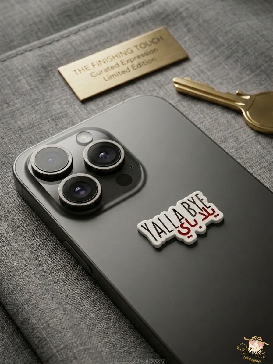 Phone case with 'Yalla Bye' sticker on a textured surface