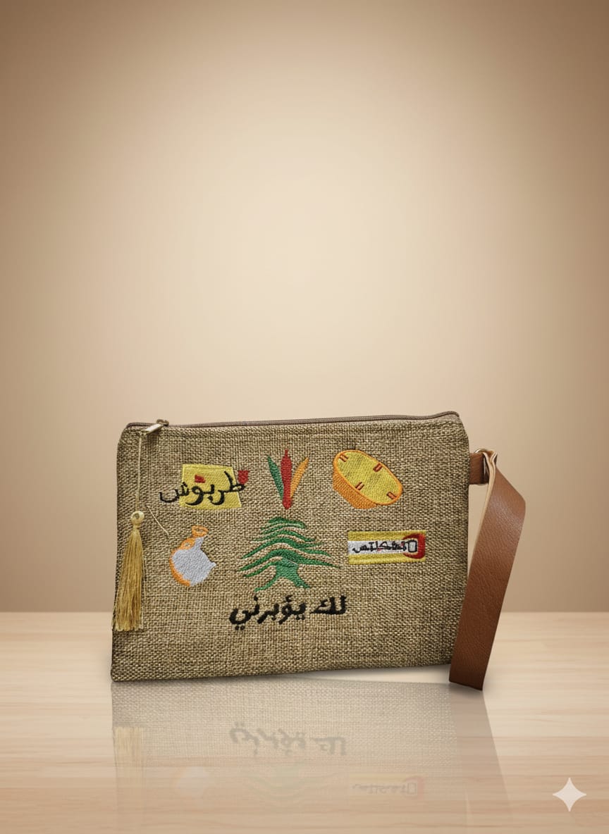 Textile bag with embroidered designs on a beige background
