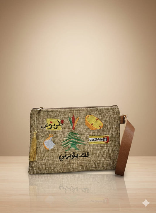 Textile bag with embroidered designs on a beige background