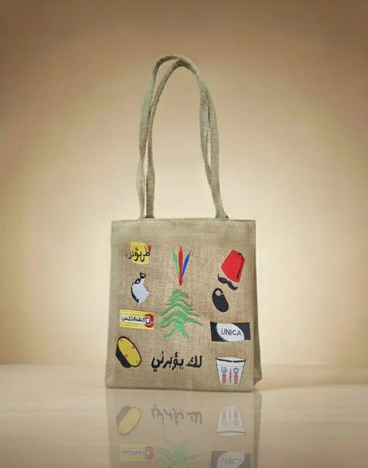 Jute bag with embroidered designs on a beige background