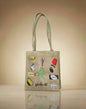 Jute bag with embroidered designs on a beige background